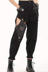 Pantalon long pour femme en cuir noir punk découpé avec chaîne en métal détachable